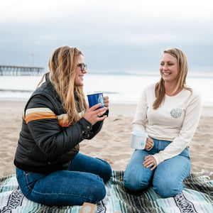 Surfer girls in CA with campfire coffee mugs and eco wax